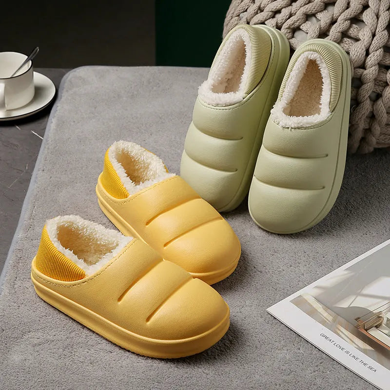 Green waterproof EVA cotton slipper with plush lining, flat sole, and hollow slip-on design.