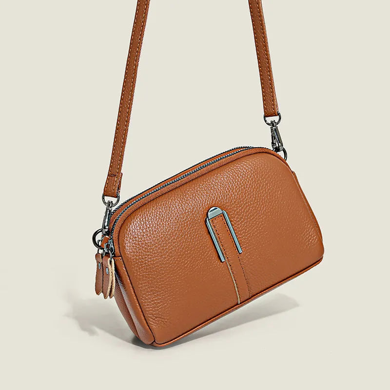 Top-grain leather crossbody bag with splicing design in khaki, horizontal shape, on model