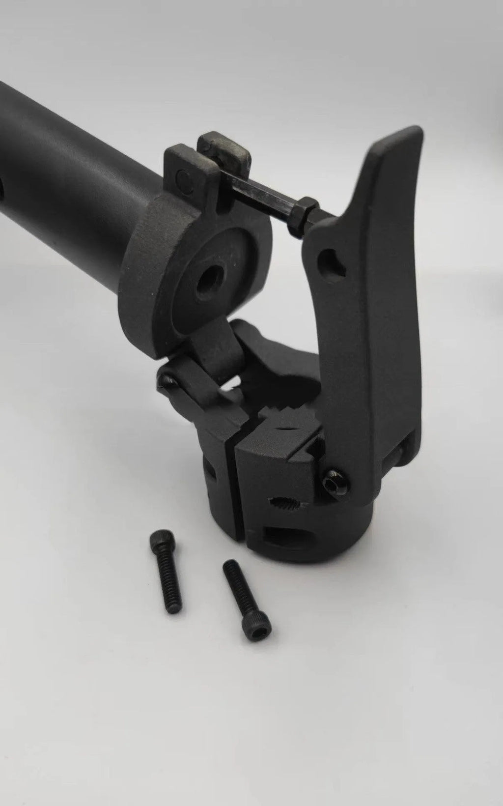 Black aluminium folding handlebar accessory for a Ninebot electric scooter, shown folded and unfolded.