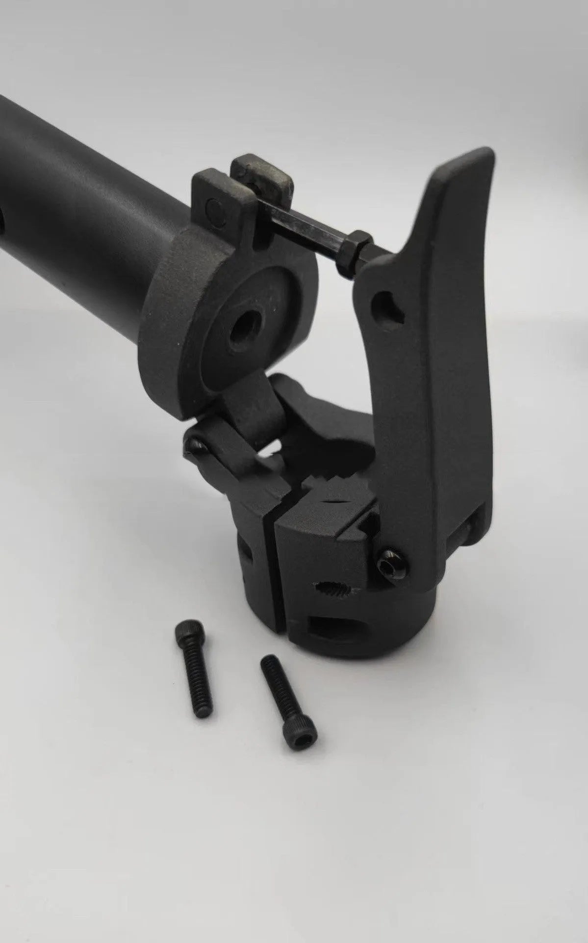 Black aluminium folding handlebar accessory for a Ninebot electric scooter, shown folded and unfolded.