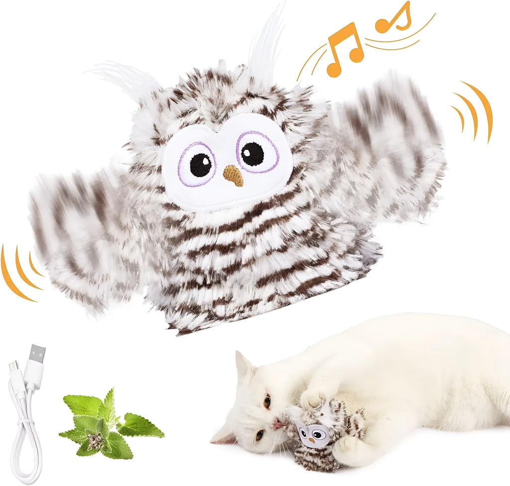 Grey automatic chirping owl cat toy with flapping wings on a flat surface.