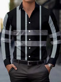 Man wearing a striped long sleeve button-down shirt in blue, showing the collar and cuffs.