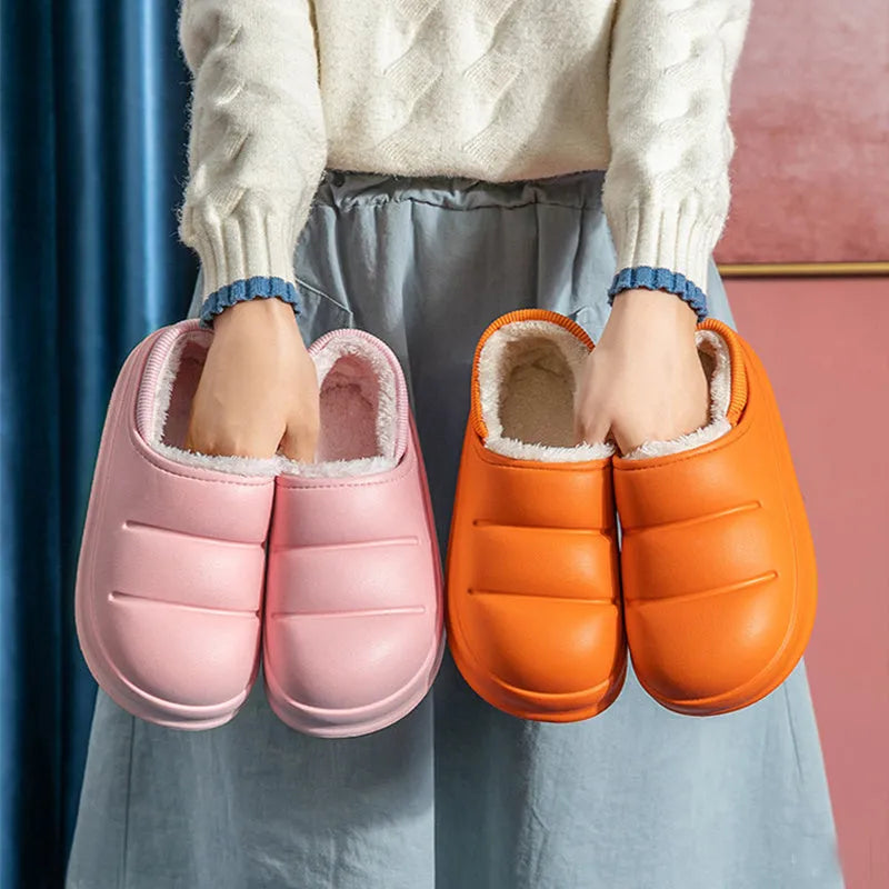 Green waterproof EVA cotton slipper with plush lining, flat sole, and hollow slip-on design.