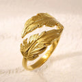 Women's stainless steel feather ring with adjustable opening in gold or silver finish