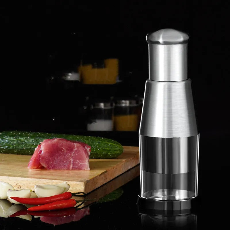Black manual garlic press and vegetable chopper with stainless steel blades measuring 6x16 cm